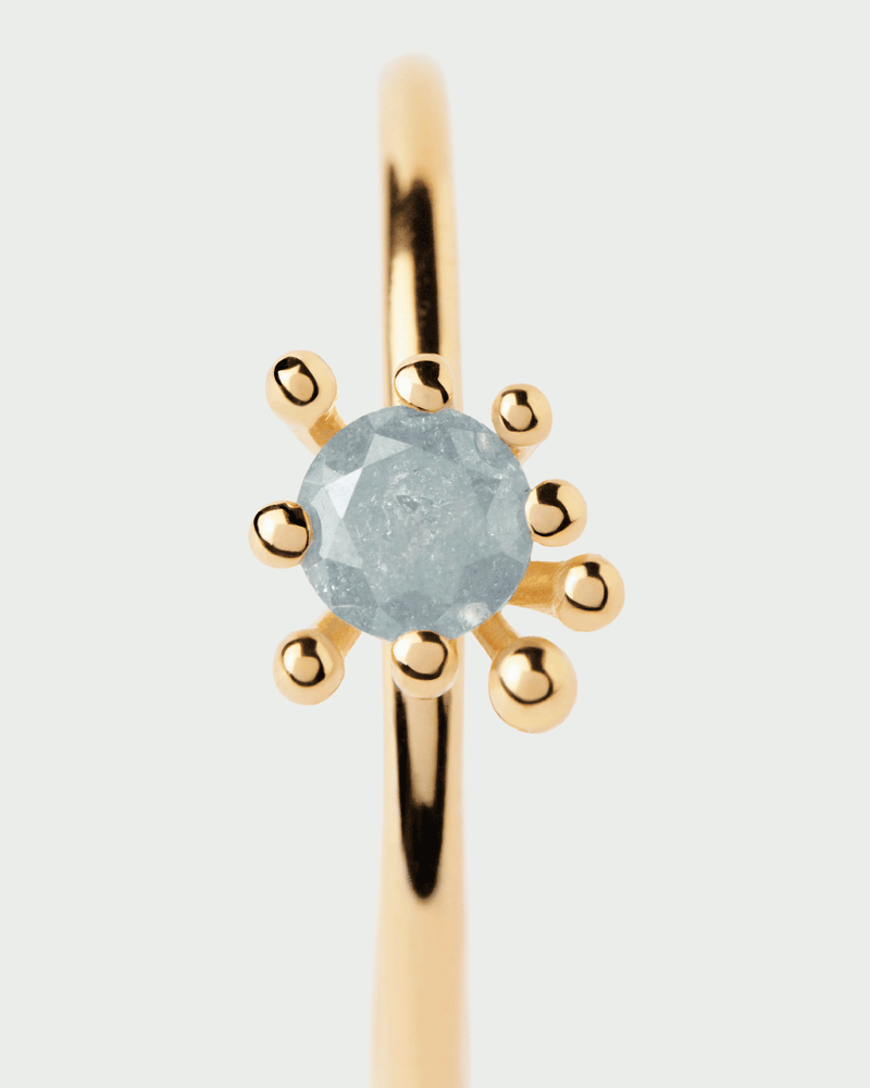 Gold-plated organic ring set with iced grey zirconia surrounded by multi-prong setting